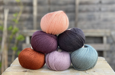 Six balls of yarn in coordinating colours