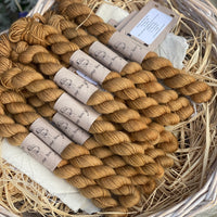 Golden brown yarn in a wicker basket