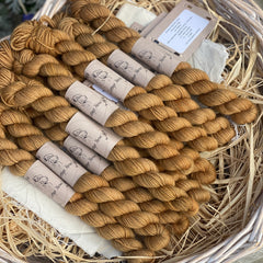 Golden brown yarn in a wicker basket