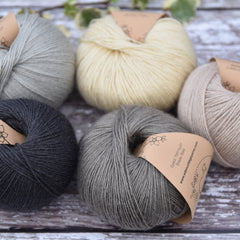 Five balls of Milburn in shades of grey, cream and beige