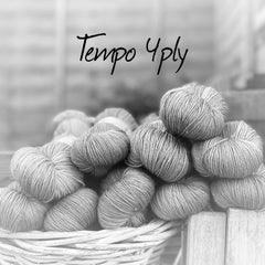 Black and white image of skeins of yarn with "Tempo 4ply" overlaid in black text