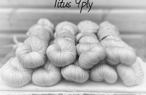 Black and white image of skeins of yarn with "Titus 4ply" overlaid in black text